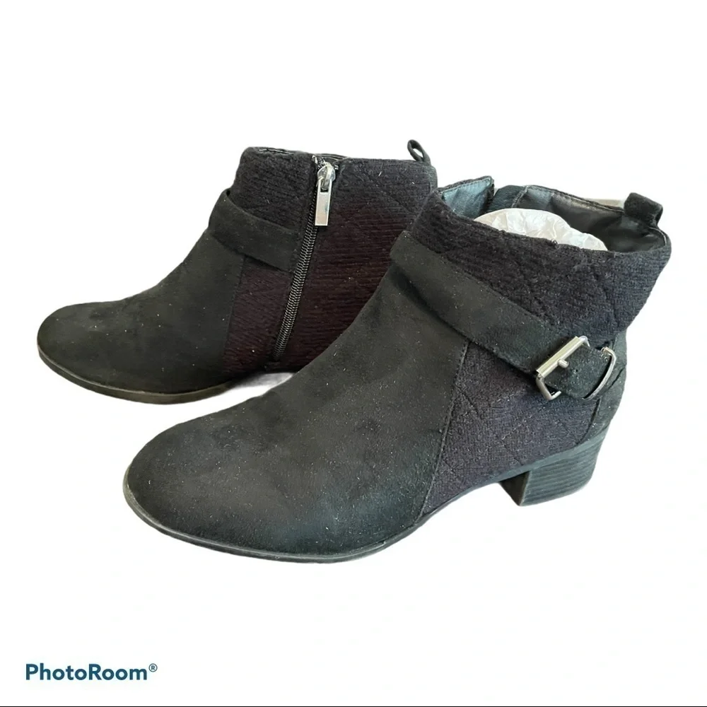 Women’s black ankle boots with buckle accents